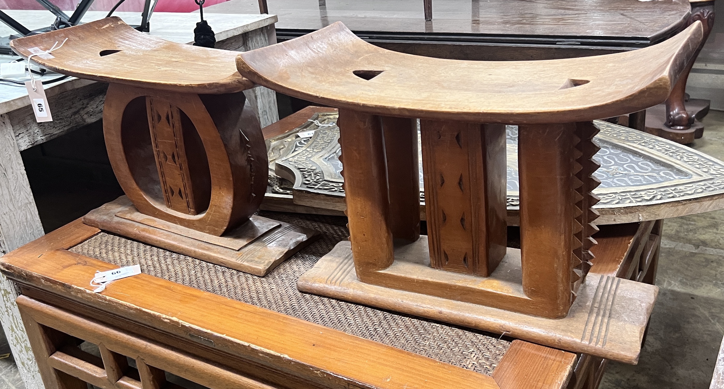 Two African hardwood stools, width 25cm, height 37cm